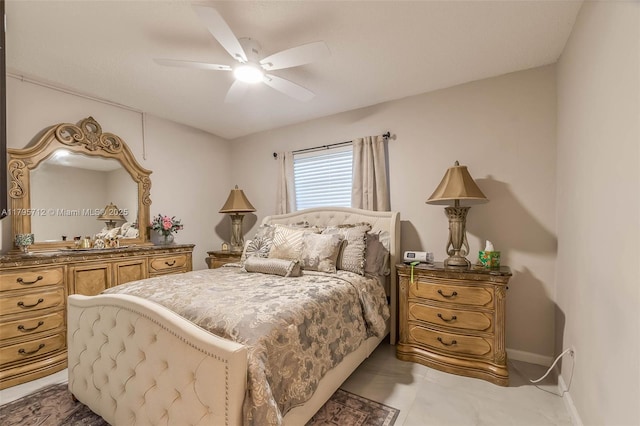 bedroom featuring a ceiling fan and baseboards