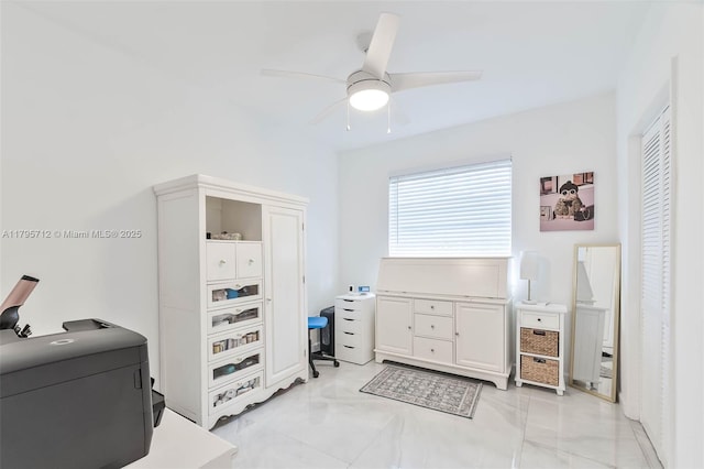 bedroom with ceiling fan and marble finish floor