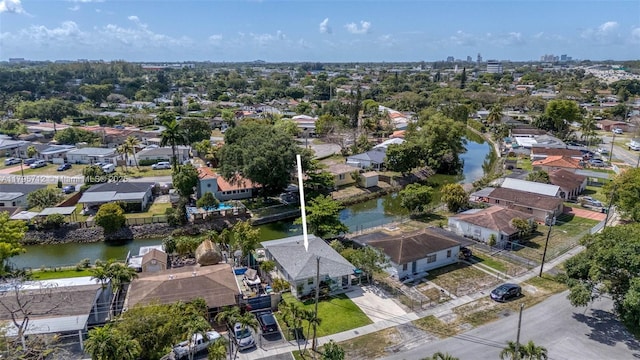 drone / aerial view with a residential view and a water view