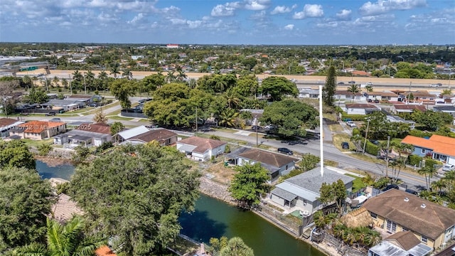 bird's eye view with a water view and a residential view