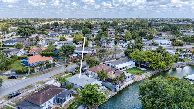 birds eye view of property with a residential view and a water view