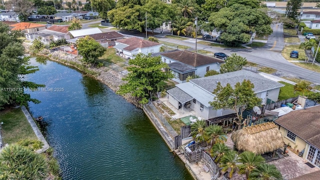 bird's eye view with a water view and a residential view