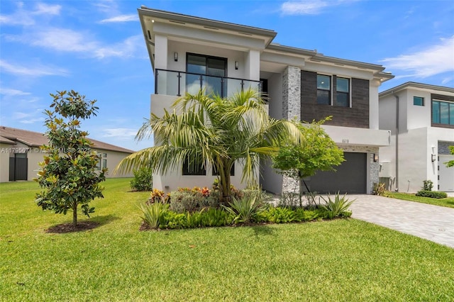 8215 Crystal Downs Ave, Boca Raton, FL 33434 - view of front of property featuring an attached garage, decorative driveway, stucco siding, and a balcony