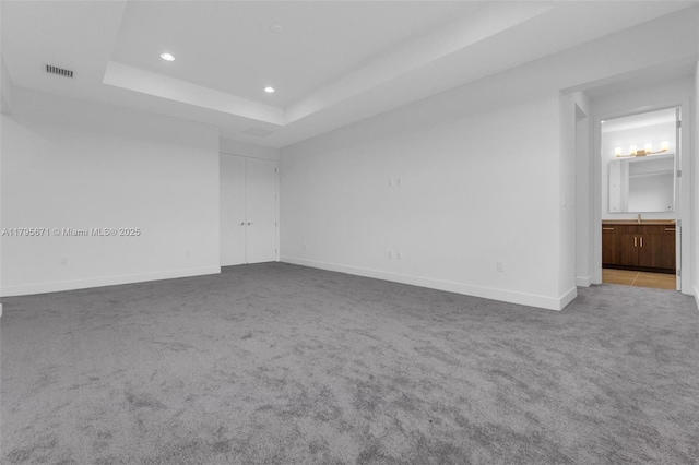 8215 Crystal Downs Ave, Boca Raton, FL 33434 - carpeted spare room featuring a raised ceiling, recessed lighting, and baseboards