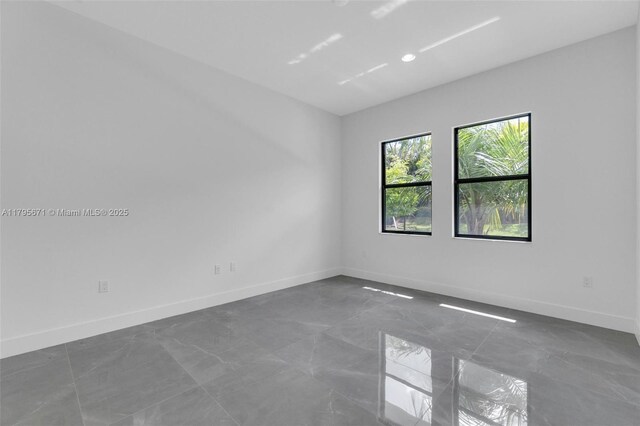 8215 Crystal Downs Ave, Boca Raton, FL 33434 - empty room featuring baseboards, marble finish floors, and recessed lighting