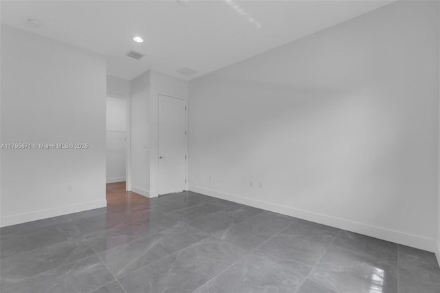 8215 Crystal Downs Ave, Boca Raton, FL 33434 - spare room featuring baseboards and recessed lighting