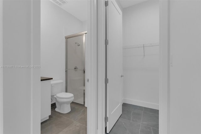 8215 Crystal Downs Ave, Boca Raton, FL 33434 - bathroom with a stall shower, toilet, and a walk in closet