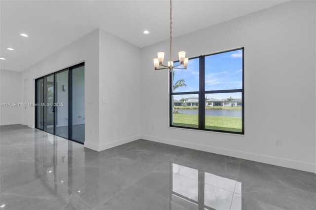 8215 Crystal Downs Ave, Boca Raton, FL 33434 - unfurnished room with baseboards, recessed lighting, a chandelier, and a water view