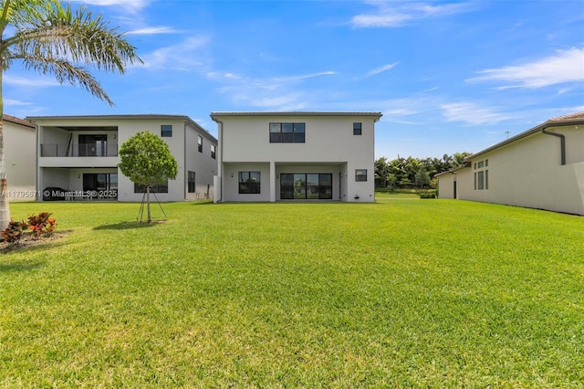 8215 Crystal Downs Ave, Boca Raton, FL 33434 - rear view of property featuring stucco siding and a yard