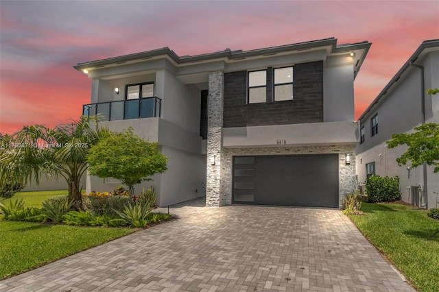 8215 Crystal Downs Ave, Boca Raton, FL 33434 - view of front of home with stucco siding, decorative driveway, an attached garage, and a front lawn