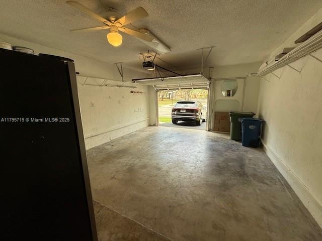 garage featuring a ceiling fan and a garage door opener