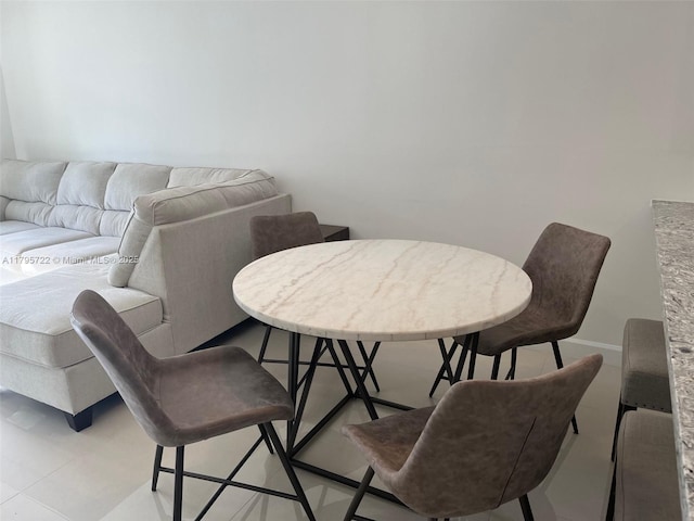 dining room with baseboards