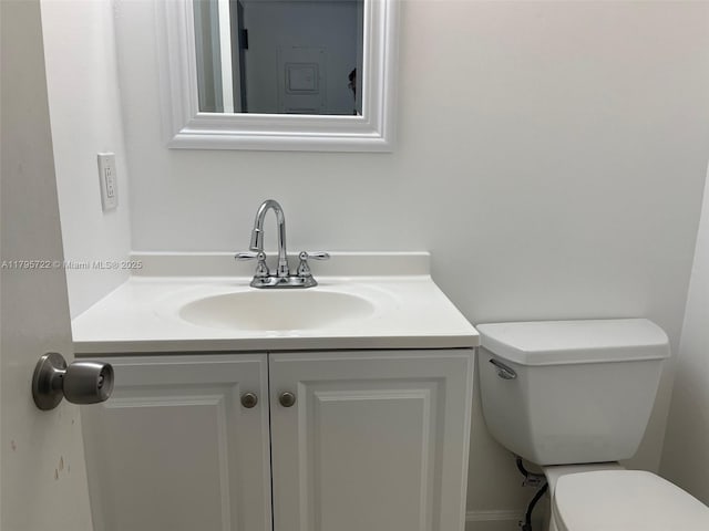 bathroom with vanity and toilet