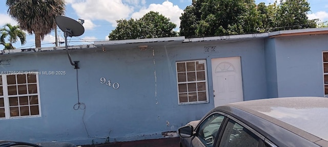view of side of home featuring stucco siding