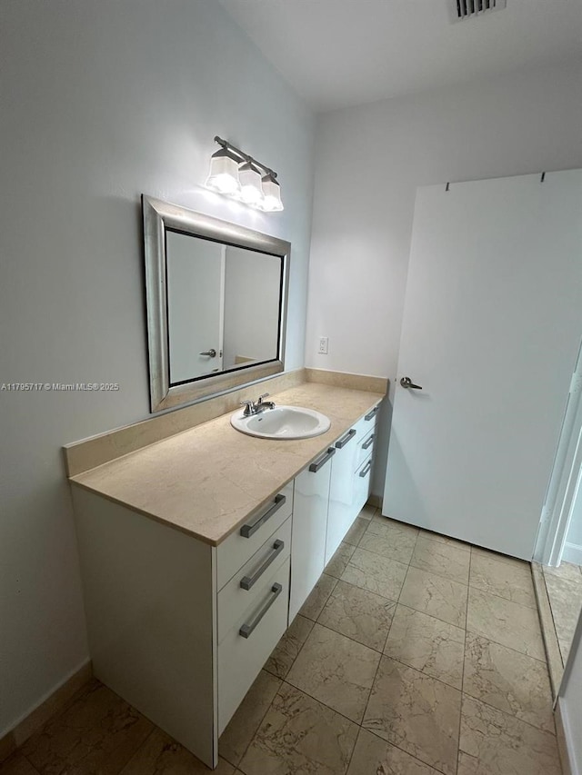 bathroom with vanity, marble finish floor, and visible vents
