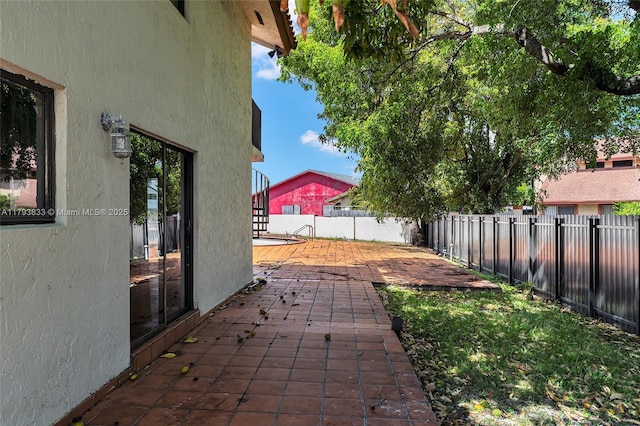 839 W 39th Pl, Hialeah, FL 33012 - fenced backyard featuring a patio area