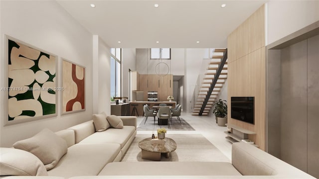 living area featuring recessed lighting and stairway