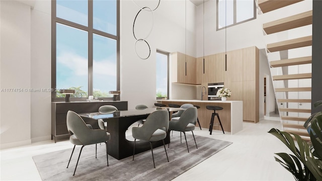 dining room with a high ceiling