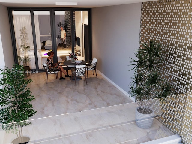 dining area featuring baseboards
