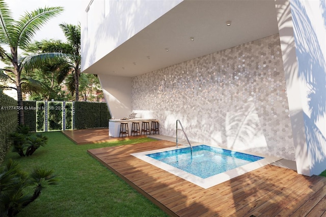 view of swimming pool with a lawn, outdoor dry bar, and a wooden deck