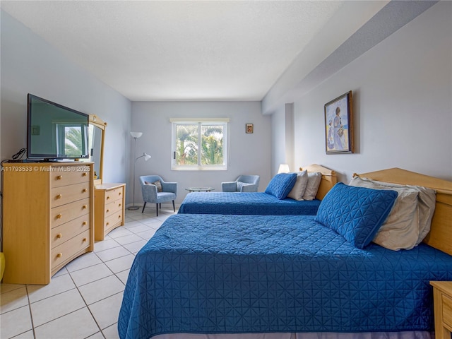bedroom featuring light tile patterned floors