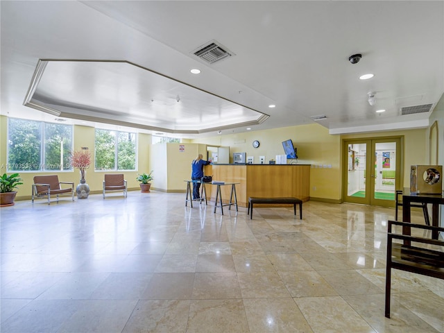 reception area featuring visible vents and french doors