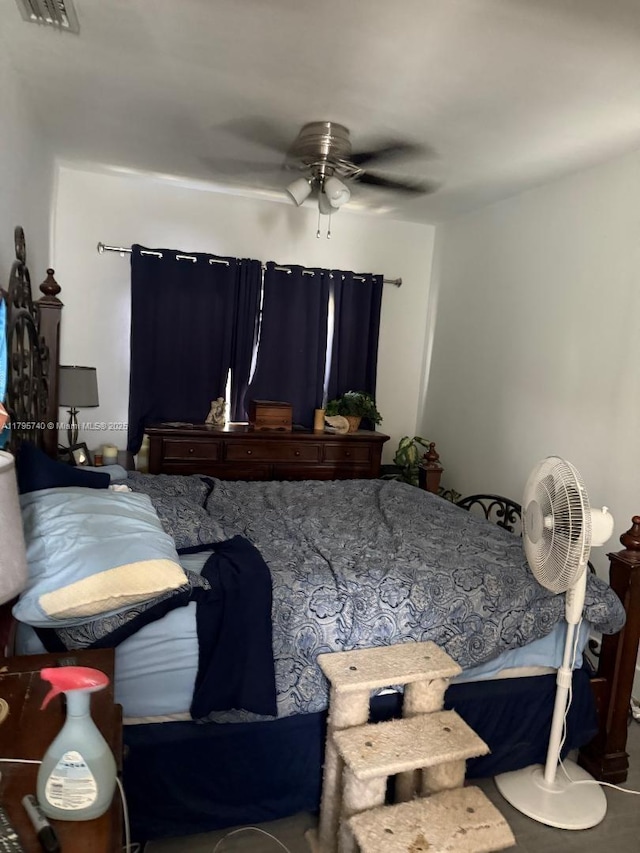 bedroom featuring ceiling fan and visible vents