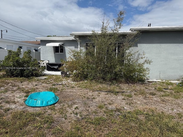 back of property with stucco siding