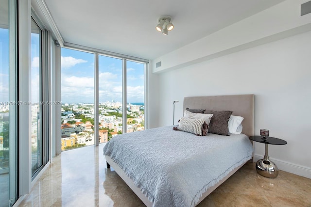 1000 S Pointe Dr Unit 1903, Miami Beach, FL 33139 - bedroom with visible vents, multiple windows, and a wall of windows