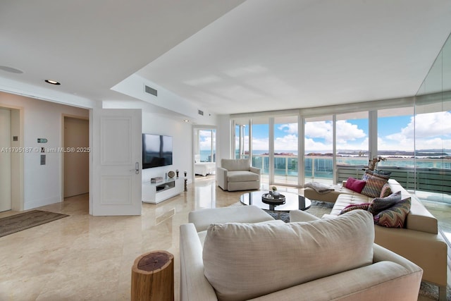 1000 S Pointe Dr Unit 1903, Miami Beach, FL 33139 - living room featuring a wall of windows, recessed lighting, and visible vents