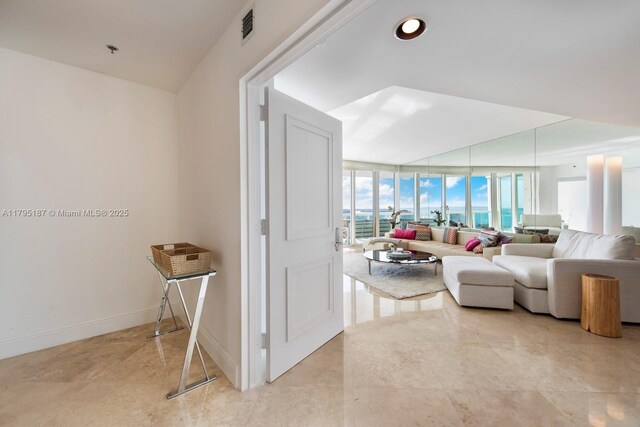 1000 S Pointe Dr Unit 1903, Miami Beach, FL 33139 - corridor with a wall of windows, baseboards, and visible vents