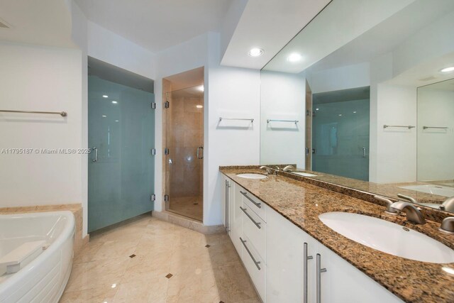 1000 S Pointe Dr Unit 1903, Miami Beach, FL 33139 - full bathroom featuring a sink, a bath, and a shower stall