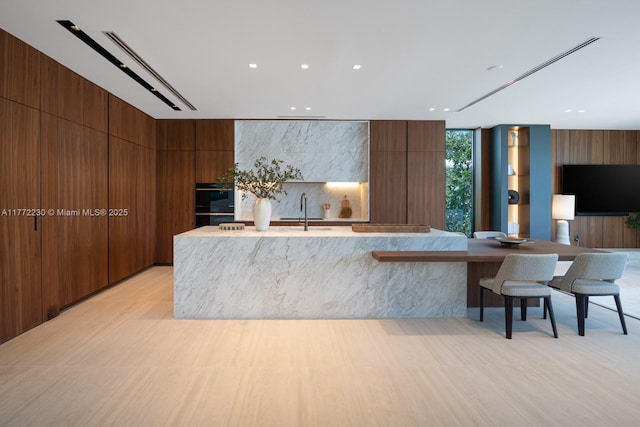 5515 Pine Tree Dr, Miami Beach, FL 33140 - welcome area with recessed lighting, wooden walls, and a sink