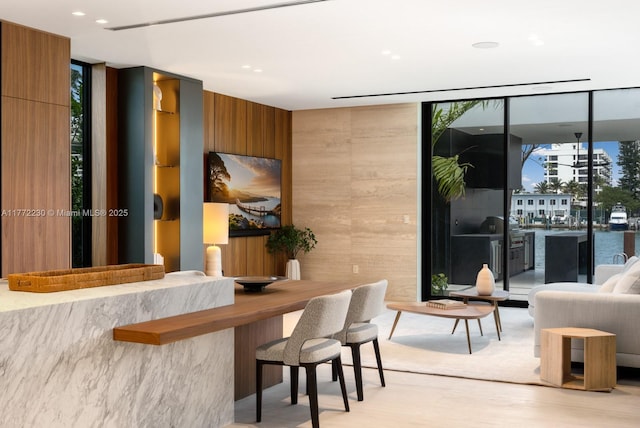 5515 Pine Tree Dr, Miami Beach, FL 33140 - reception area featuring a wall of windows and wood walls