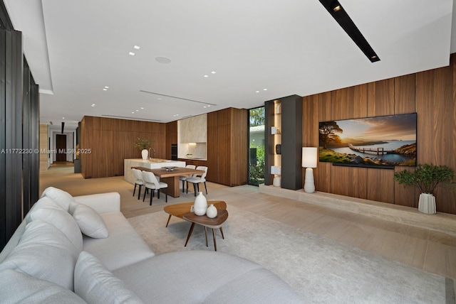 5515 Pine Tree Dr, Miami Beach, FL 33140 - living room with a wall of windows, wooden walls, and recessed lighting