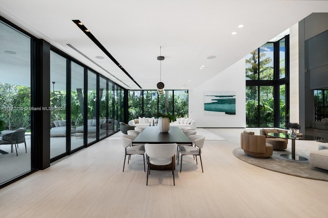 5515 Pine Tree Dr, Miami Beach, FL 33140 - dining space featuring expansive windows and recessed lighting