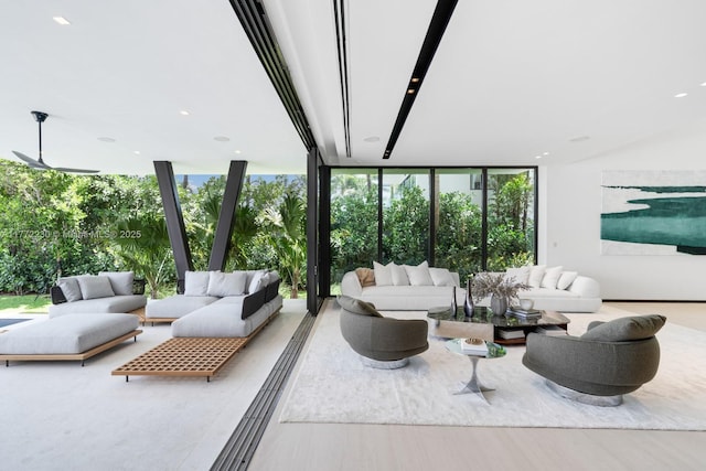 5515 Pine Tree Dr, Miami Beach, FL 33140 - living area featuring a wall of windows and wood finished floors