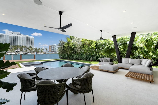 5515 Pine Tree Dr, Miami Beach, FL 33140 - view of patio / terrace featuring an outdoor hangout area, ceiling fan, outdoor dining space, a water view, and an outdoor pool