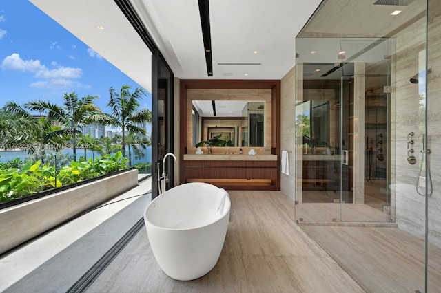 5515 Pine Tree Dr, Miami Beach, FL 33140 - full bathroom with a stall shower, vanity, and a freestanding tub