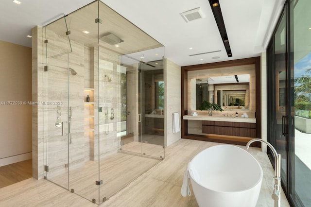 5515 Pine Tree Dr, Miami Beach, FL 33140 - full bathroom featuring wood finished floors, a stall shower, and vanity