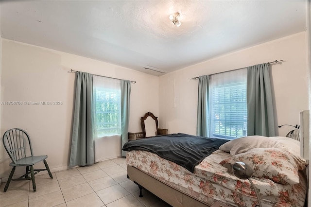 bedroom featuring light tile patterned floors