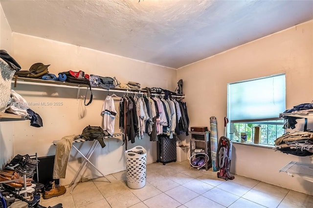 spacious closet featuring tile patterned flooring