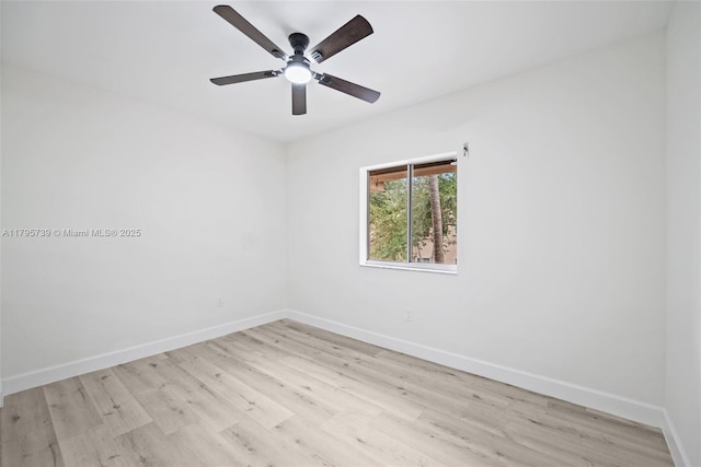 empty room with a ceiling fan, baseboards, and light wood-style flooring