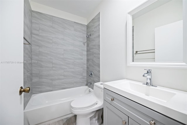 full bath featuring toilet, shower / bathing tub combination, and vanity