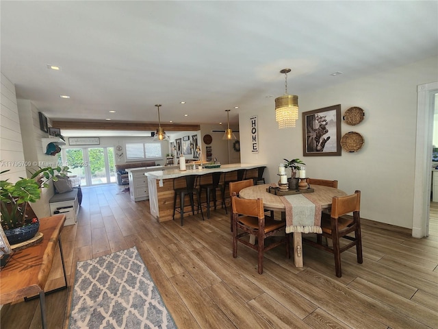 dining area featuring recessed lighting and wood finished floors