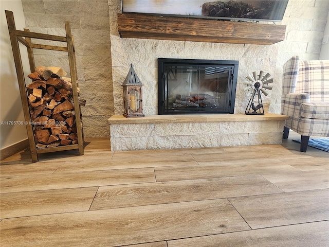 details with a fireplace and wood finished floors