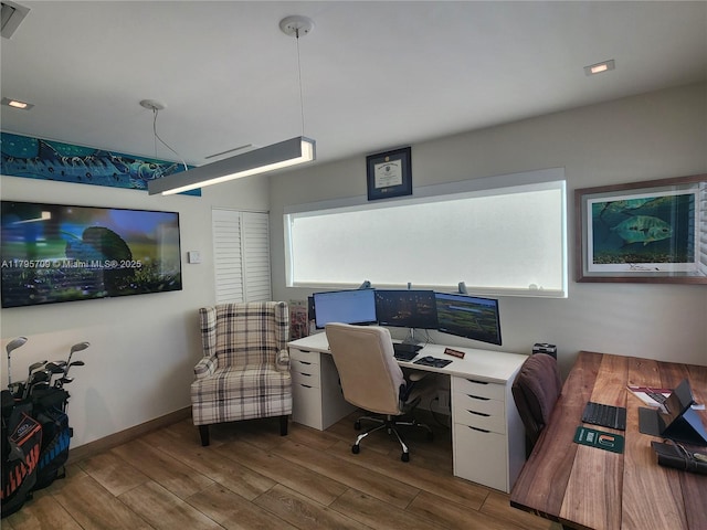 office space featuring wood finished floors and a wealth of natural light
