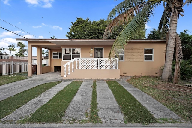4241 W 1st Ave, Hialeah, FL 33012 - bungalow-style house featuring fence, stucco siding, driveway, and crawl space