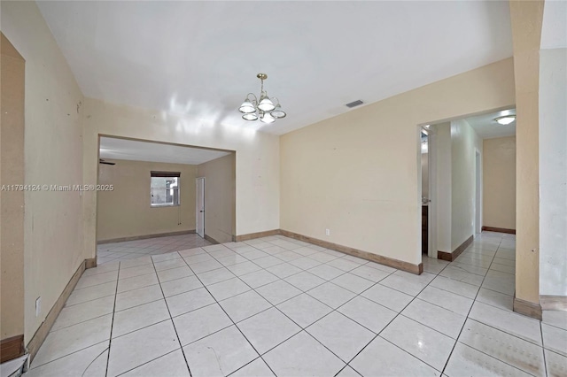 4241 W 1st Ave, Hialeah, FL 33012 - spare room featuring light tile patterned flooring, baseboards, visible vents, and an inviting chandelier