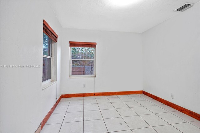4241 W 1st Ave, Hialeah, FL 33012 - unfurnished room featuring baseboards and visible vents